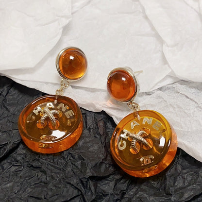 Boucles d'oreilles pendantes orange CC 18 carats