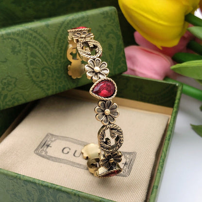 Bracelet manchette ouvert avec cristaux rouges et fleurs Double G 18 carats