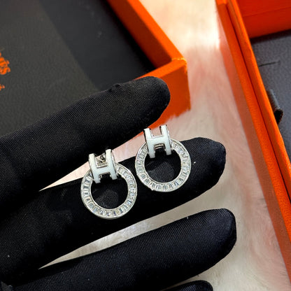 Boucles d'oreilles diamant Clic H 18 carats