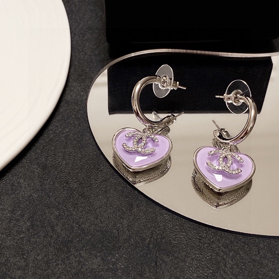 Boucles d'oreilles coeur violet 18 carats CC