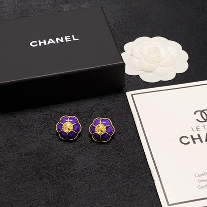 Boucles d'oreilles fleurs violettes 18 carats CC