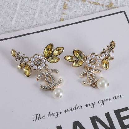 Boucles d'oreilles en cristaux de fleurs CC 18 carats