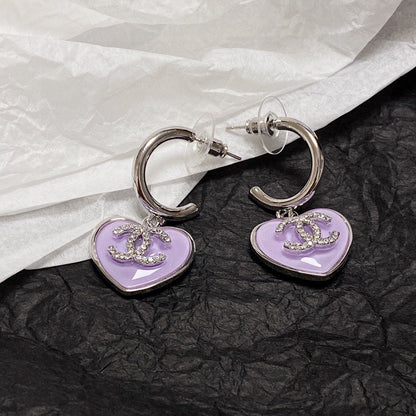 Boucles d'oreilles coeur violet 18 carats CC